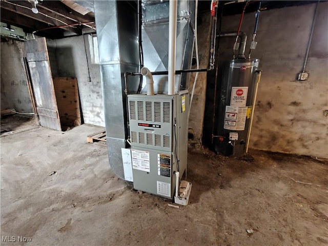 utility room featuring heating unit and gas water heater