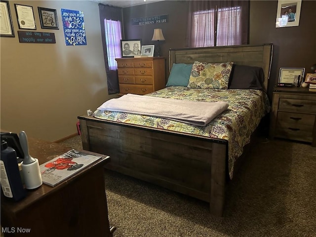 bedroom with dark carpet