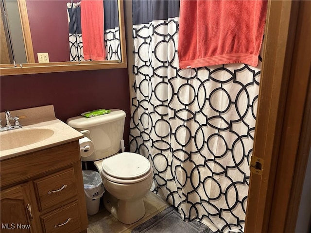 bathroom featuring toilet and vanity