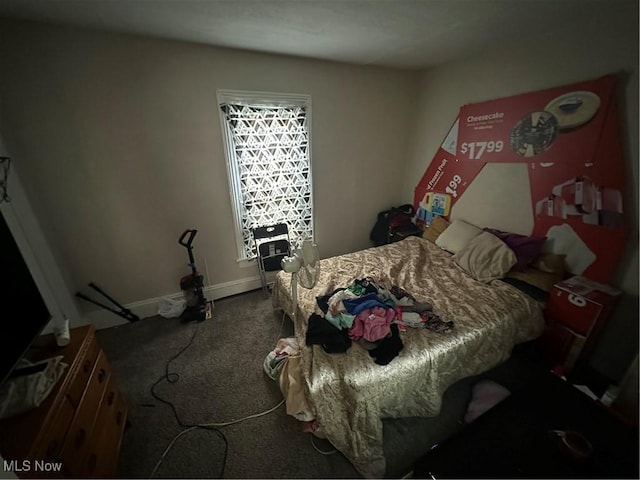 carpeted bedroom with baseboards