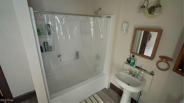full bathroom with a sink and shower / tub combo