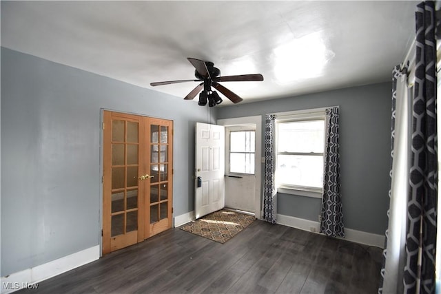 entryway with dark hardwood / wood-style floors and ceiling fan