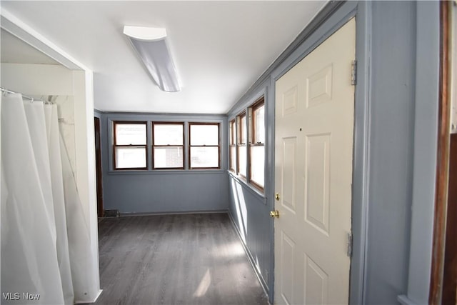 hallway featuring dark wood-type flooring