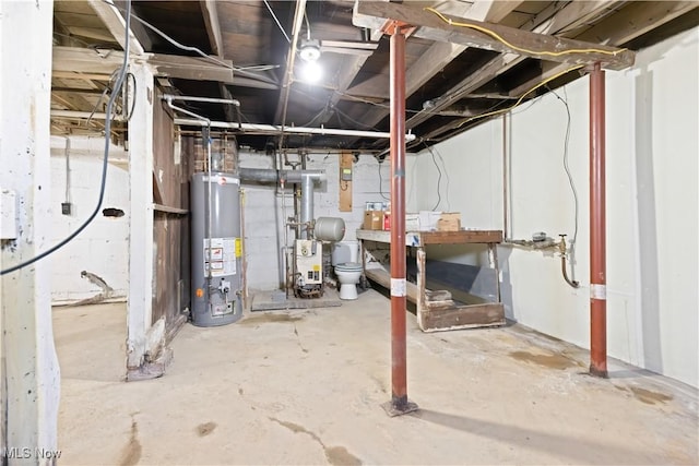 unfinished below grade area with water heater and a heating unit