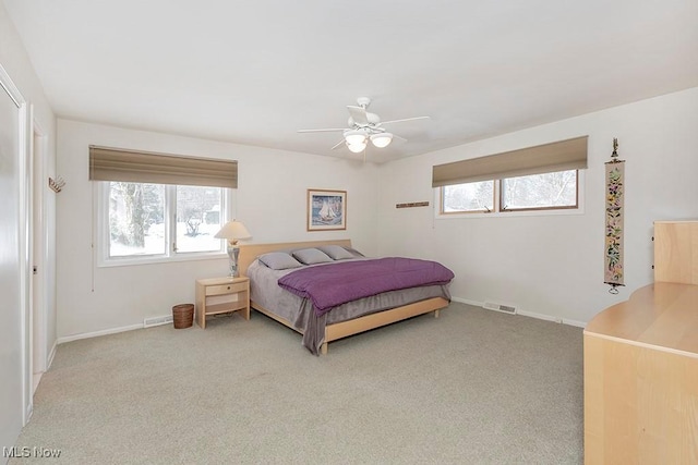 carpeted bedroom with ceiling fan