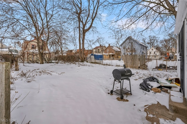 view of yard layered in snow