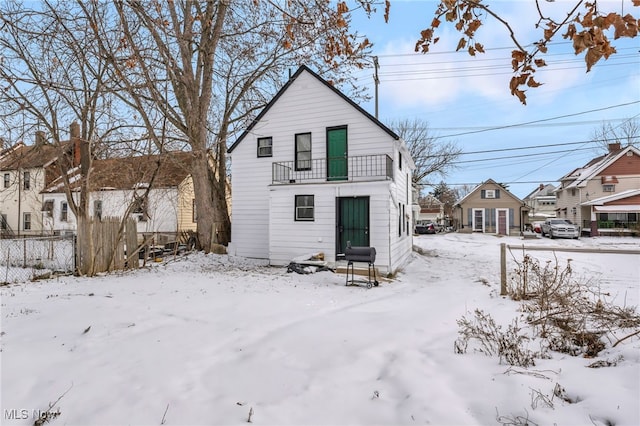 view of snow covered house