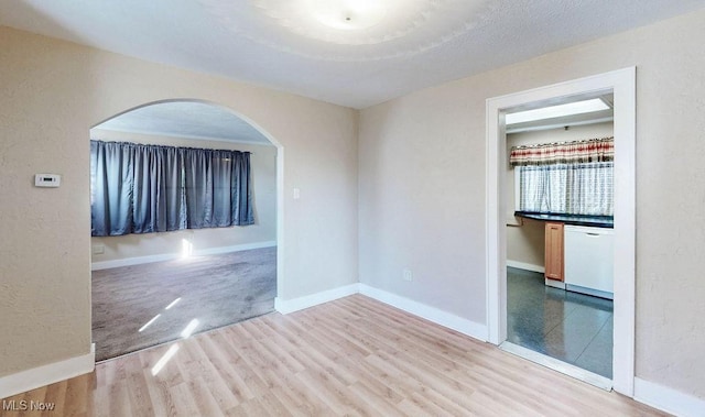 unfurnished room with hardwood / wood-style flooring