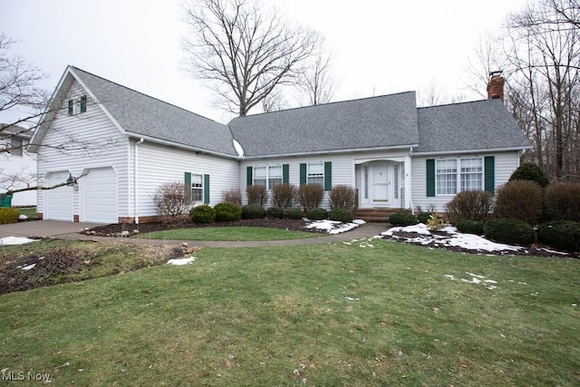 view of front of home with a garage and a front yard