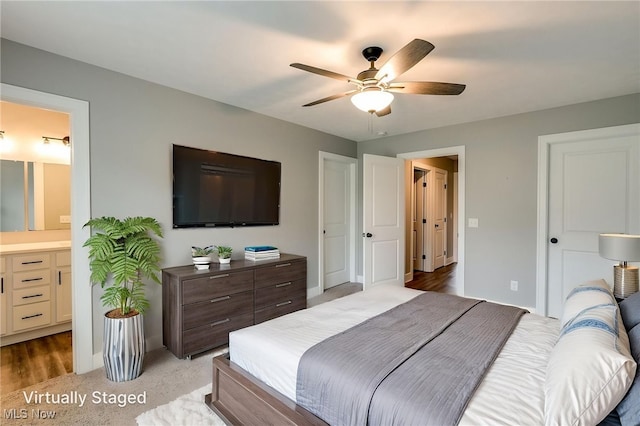 921 Cabot Dr, Canal Fulton, OH 44614 - bedroom with ensuite bathroom, baseboards, and ceiling fan