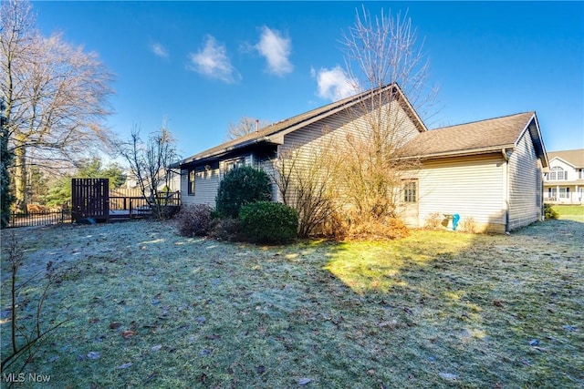 view of property exterior featuring a yard