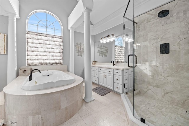 bathroom featuring crown molding, separate shower and tub, ornate columns, and vanity