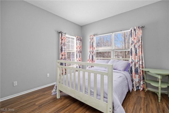 bedroom featuring dark hardwood / wood-style floors