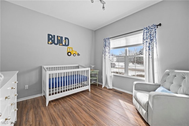 bedroom featuring dark hardwood / wood-style floors