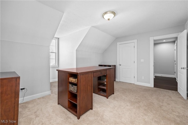 office featuring light carpet and lofted ceiling