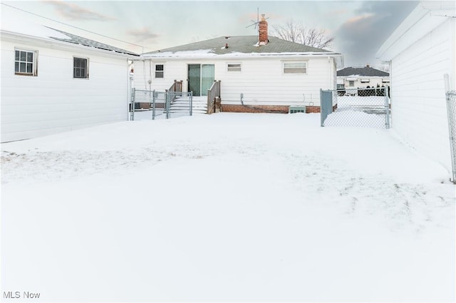 view of snow covered property