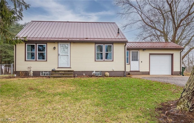 view of front of property with a front lawn and a garage