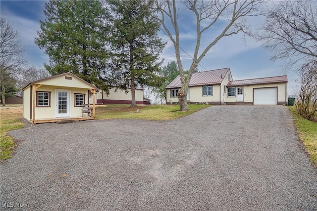 ranch-style house with a front yard and a garage