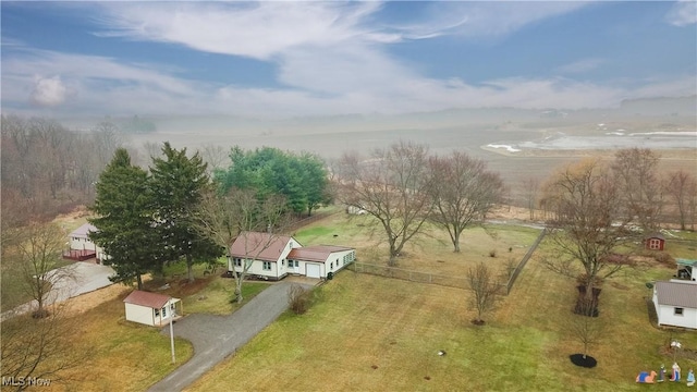 birds eye view of property with a rural view