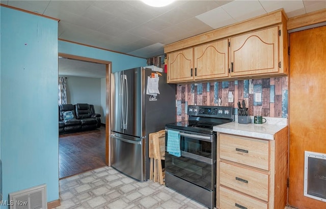 kitchen with stainless steel appliances and backsplash