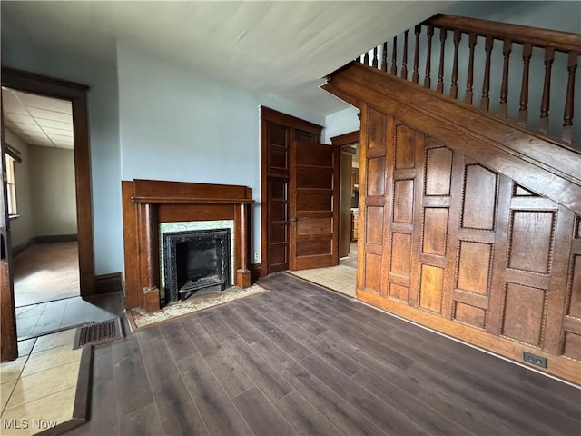 unfurnished living room with light hardwood / wood-style flooring