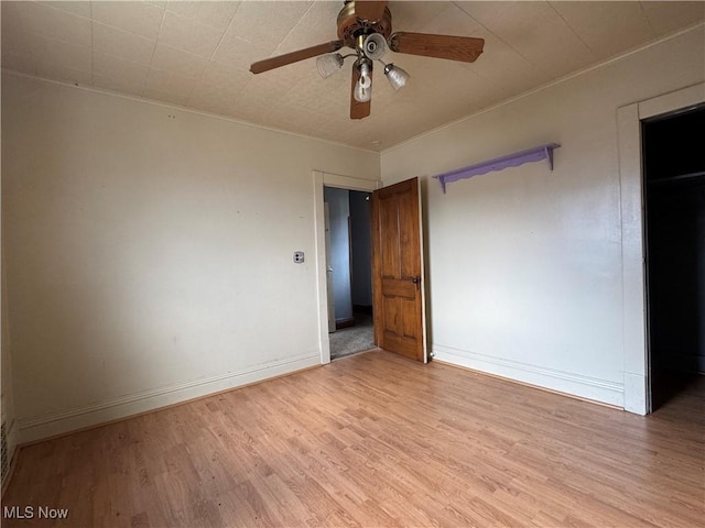 spare room with ceiling fan and light hardwood / wood-style flooring