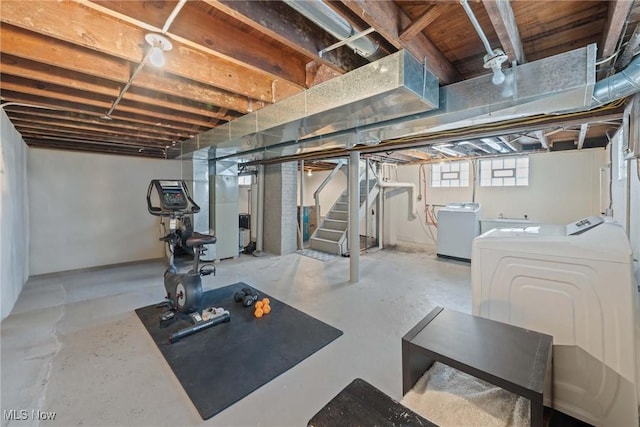 workout area featuring washing machine and dryer