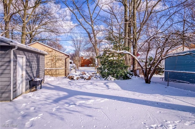 view of yard covered in snow