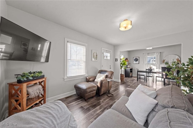 living room with dark wood-type flooring