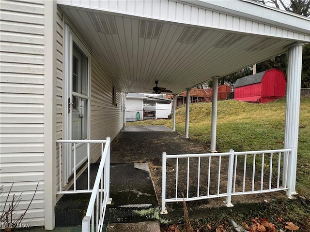 exterior space featuring a yard and ceiling fan