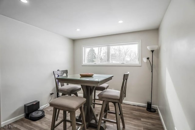 dining area featuring dark wood-type flooring