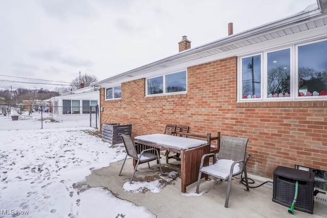 view of snow covered patio