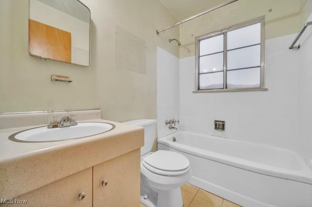 full bathroom with shower / tub combination, vanity, toilet, and tile patterned floors