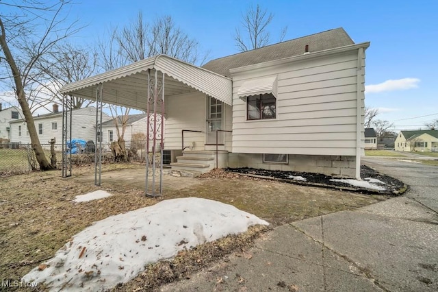 view of front of house featuring a residential view and fence