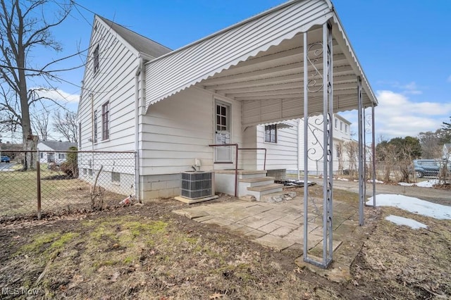 view of property exterior featuring crawl space, fence, and cooling unit