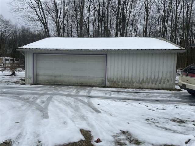 view of snow covered garage