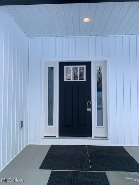 1775 Green Rd, Madison, OH 44057 - property entrance featuring board and batten siding