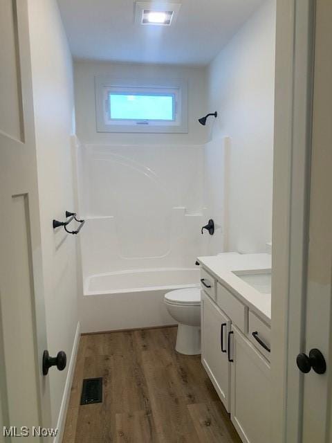 1775 Green Rd, Madison, OH 44057 - full bath featuring vanity, toilet,  shower combination, and wood finished floors