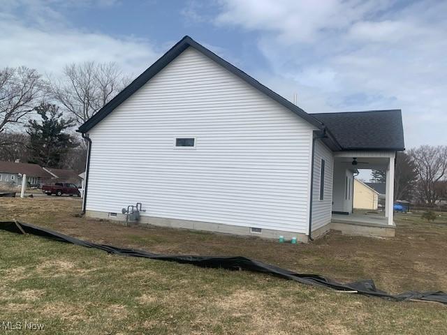 1775 Green Rd, Madison, OH 44057 - view of side of property featuring crawl space and covered porch