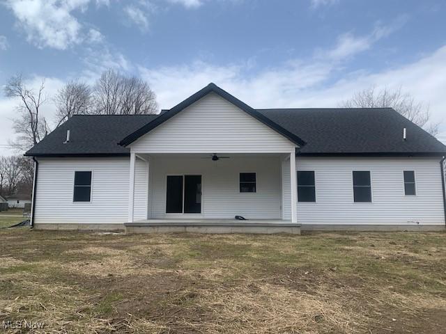 back of house featuring a ceiling fan