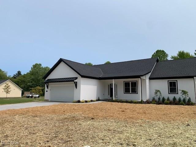1775 Green Rd, Madison, OH 44057 - view of front of property featuring an attached garage and concrete driveway