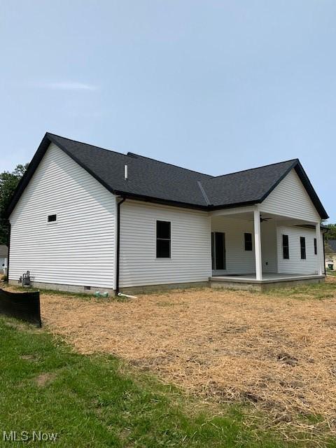1775 Green Rd, Madison, OH 44057 - rear view of house with a ceiling fan and a shingled roof