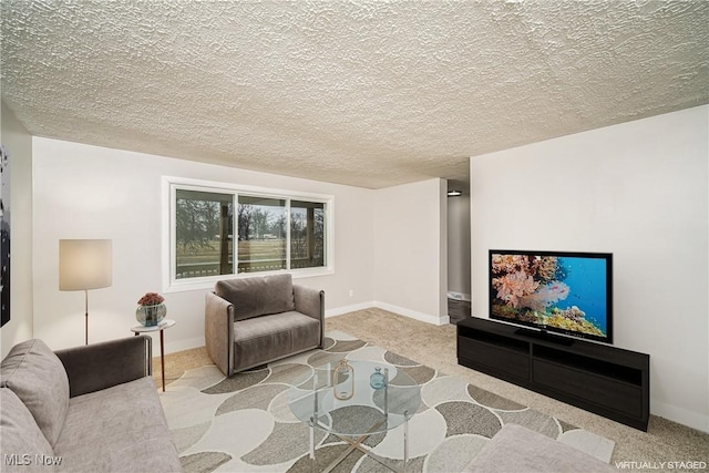 living room with a textured ceiling and light carpet