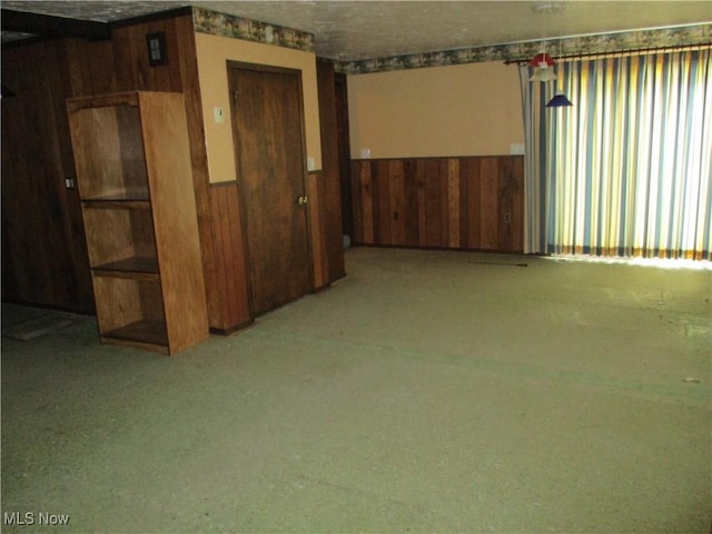 4520 E Wallings Rd, Broadview Heights, OH 44147 - empty room with wood walls, wainscoting, and carpet