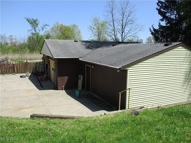 4520 E Wallings Rd, Broadview Heights, OH 44147 - view of home's exterior with a shingled roof, a patio area, and fence