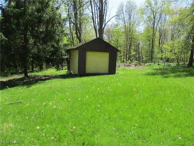 4520 E Wallings Rd, Broadview Heights, OH 44147 - view of green lawn featuring an outdoor structure and a storage unit