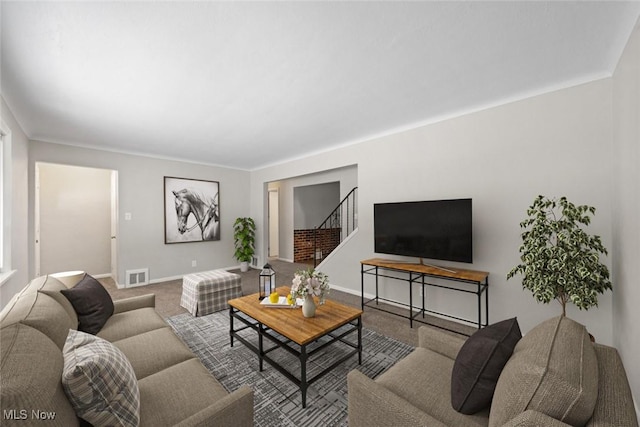 living area with baseboards, stairs, visible vents, and carpet flooring