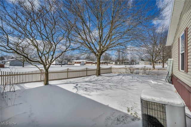 view of yard layered in snow