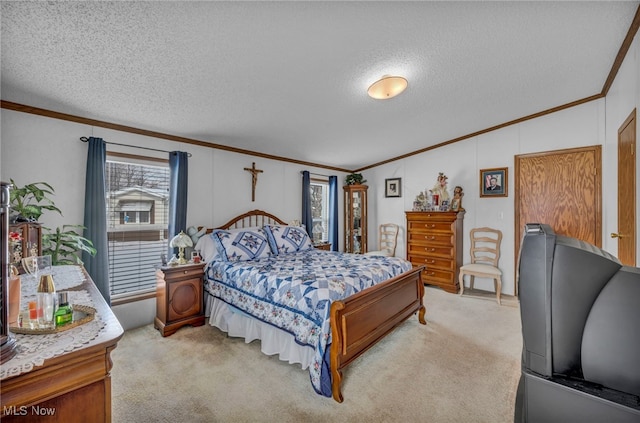 bedroom with ornamental molding, light carpet, and a textured ceiling