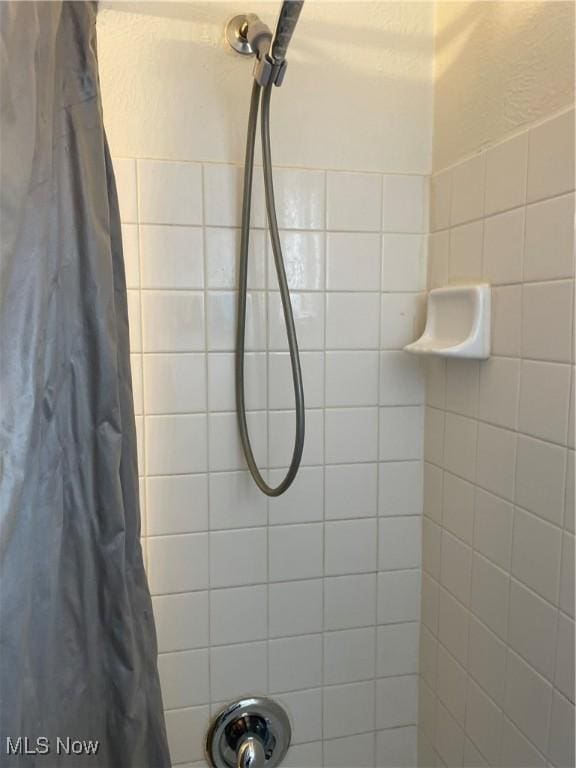 bathroom with a shower with shower curtain